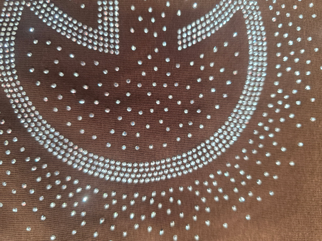 Women’s brown T‑shirt featuring silver embellishments, Size Medium/Large